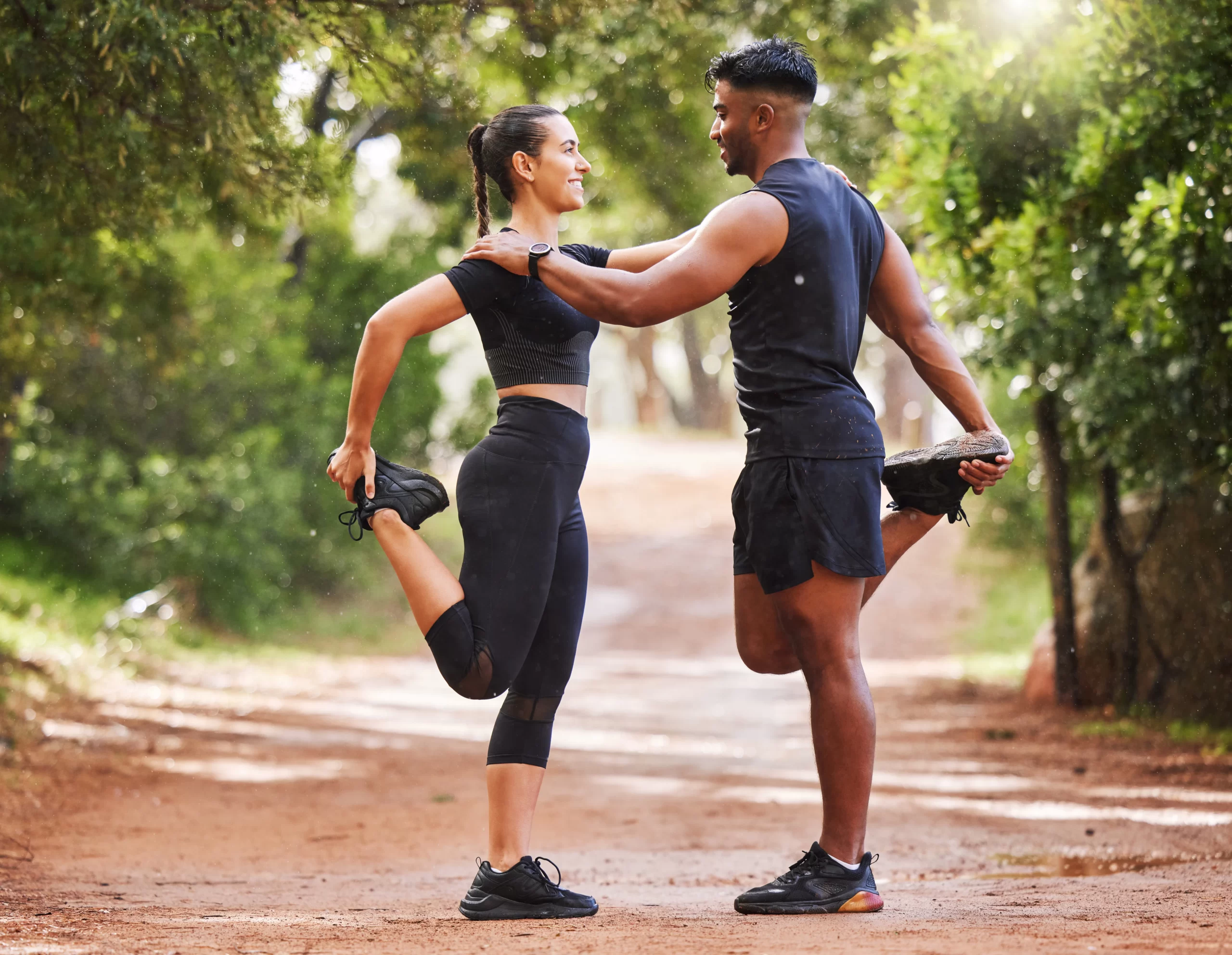 Couple stretching together outdoors